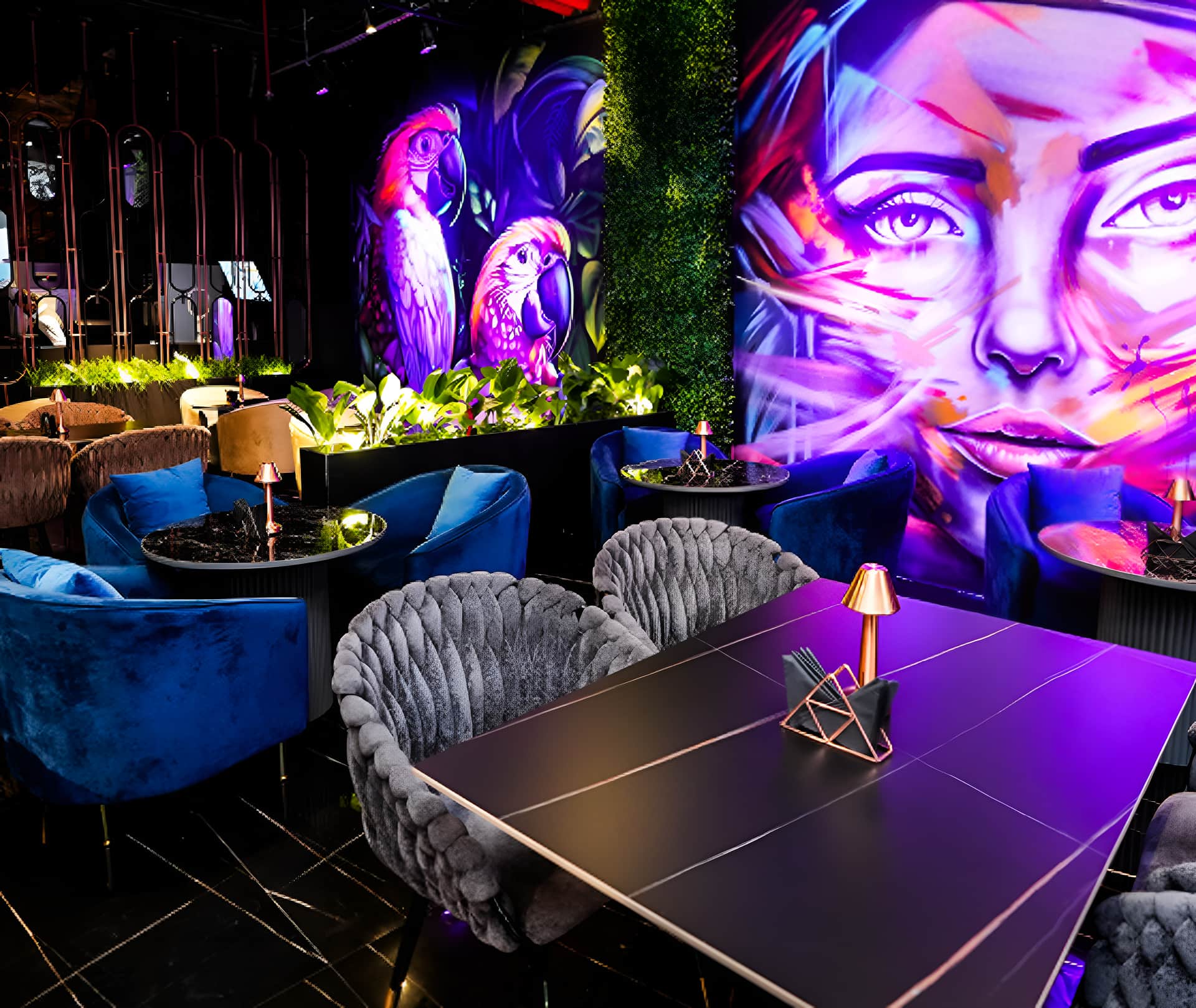 Dubai brunch spot with wall art, velvet chairs, and lamps.